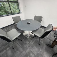 Grey 1000mm table with 4 x lounge chairs in a two tone fabric